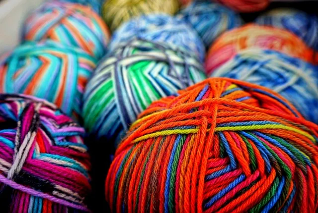 pile of balls of multi color yarn